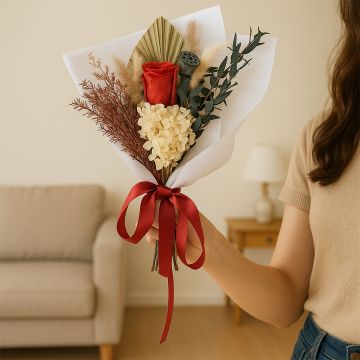 Elegant Infinity Rose Red bouquet in hand featuring preserved hydrangea eucalyptus pampas grass and lotus pod perfect for weddings gifts and home decor.
