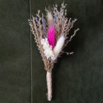 Closeup of dried flower bouquet with pink white and beige preserved stems wrapped in jute creating a rustic artificial flower arrangement.