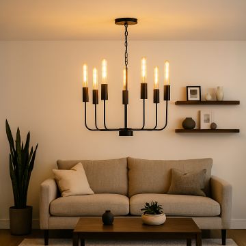 Modern black metal chandelier with eight exposed Edison tube bulbs hanging in interior space creating industrial vintage lighting.

