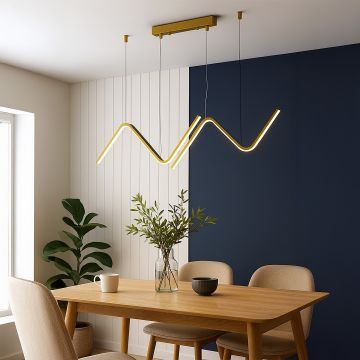 Gold sculptural pendant chandelier with sweeping wave shaped LED bars suspended above a dining setup creating a warm artistic centerpiece for the interior space.