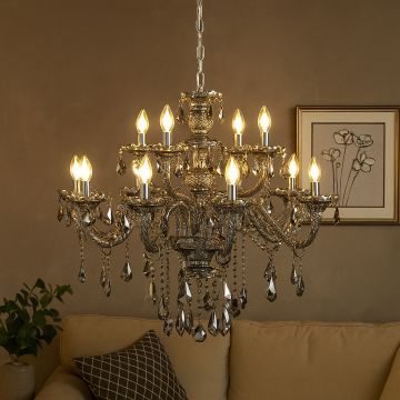 Black crystal chandelier glowing warmly in modern living room with beige sofa wall art and elegant interior setting.
