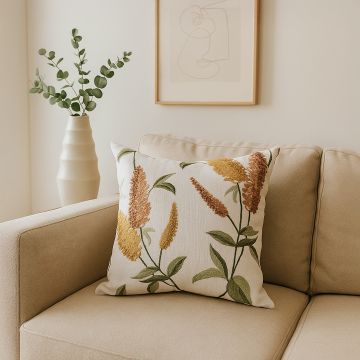 Floral cushion with warm yellow and brown botanical design adding natural charm to modern home decor.