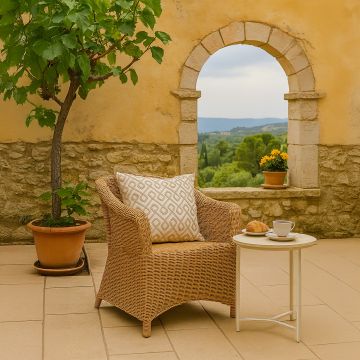 Geometric embroidered cushion adding a modern textured accent to contemporary home decor styling.