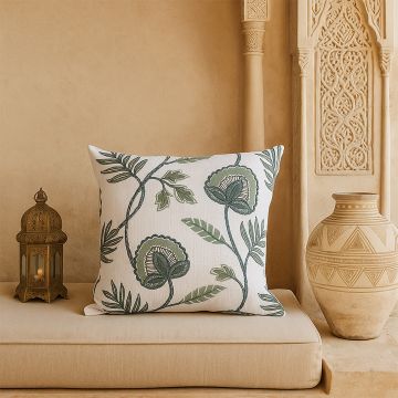 Floral embroidered cushion adding a soft natural accent to modern home decor styling.