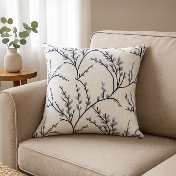 Cushion with delicate grey botanical embroidery adding a calm and elegant touch to modern decor.