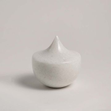 White ceramic decor item featuring a sharp peak design placed on a plain white background ideal for modern interior design.