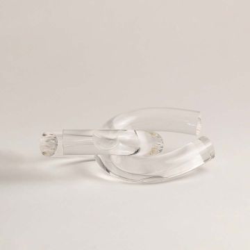 Clear glass knot decorative accent shown on white background highlighting its elegant sculptural design for home styling.
