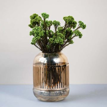Green dried statice flower stems arranged in modern gold striped glass vase elegant lifestyle home decor centerpiece.