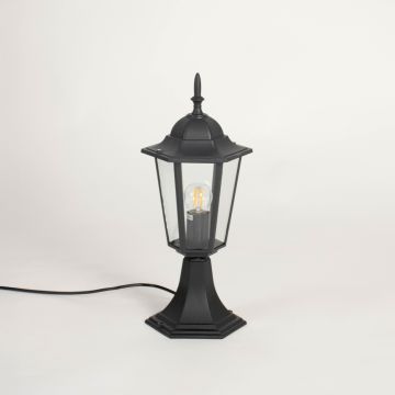 Black pillar lamp with clear glass panels and modern frame shown on white background with light off for outdoor gate decor.