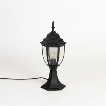 Black outdoor pillar lamp with clear glass panels and hexagonal base ideal for garden patio driveway and terrace use.