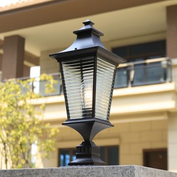 Black pillar light with layered glass panels adding modern outdoor style for garden pathways and porch decor.