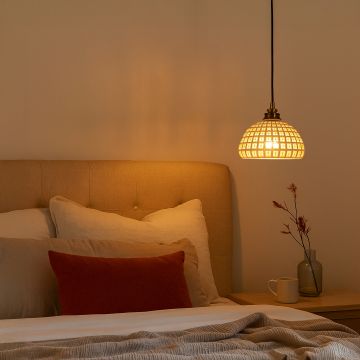 White woven pendant light with gold mount adding warm decorative lighting to a modern natural themed interior.