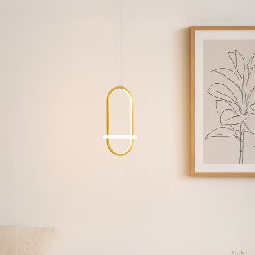 Modern gold and white metal oval hanging light styled in a minimal room creating soft ambient glow for elegant wall decor.