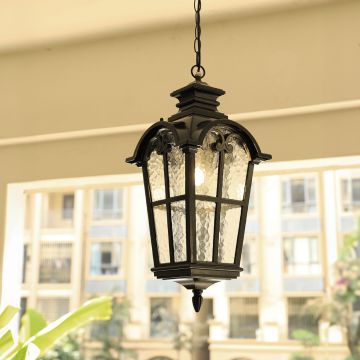 Black outdoor hanging lantern light adding classic charm and warm radiance to exterior decor.
