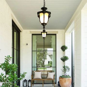 Vintage hanging lantern light adding a classic charm and warm ambience to elegant indoor or outdoor spaces.