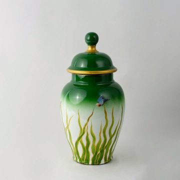 Green and white ceramic jar with golden rim and butterfly design perfect for luxury home and tabletop decor