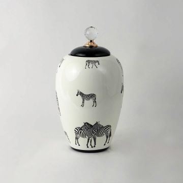 White ceramic jar with black zebra design and crystal knob lid perfect for adding a modern safari touch to decor.