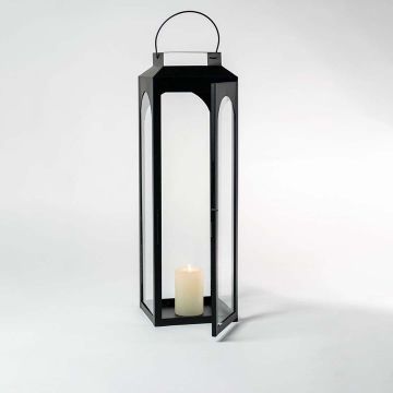 Black lantern photographed on a bright white background emphasizing its clean lines and glossy finish.