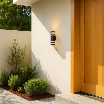 Tall black wall light adding a sophisticated modern glow to exterior and interior wall spaces.