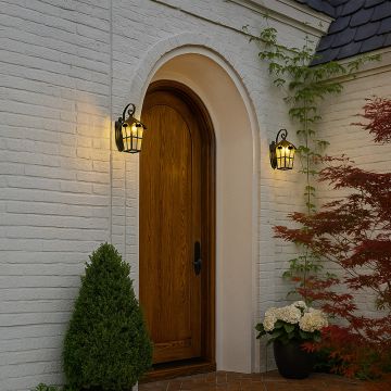 Elegant lantern wall light illuminating the entrance of a modern home