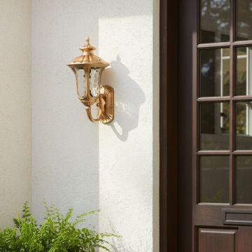 Antique gold outdoor wall lantern adding warm elegance to exterior walls for classic garden and porch lighting decor.