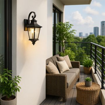 Outdoor lantern wall light mounted on a modern balcony wall illuminating a cozy rattan sofa set with green plants for a warm and stylish evening ambiance.