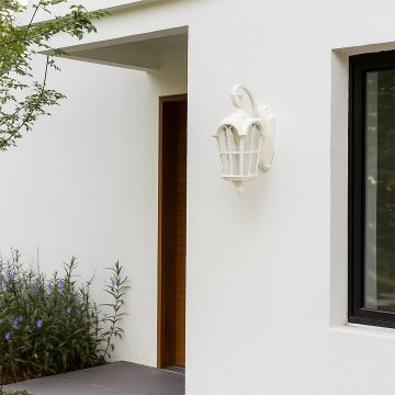 Elegant white outdoor wall light illuminating a modern home entrance with soft warm lighting creating a welcoming ambiance against clean architectural lines.
