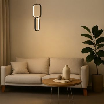 Modern black and white metal dual frame hanging light styled in a minimal room adding soft ambient glow for elegant wall decor.