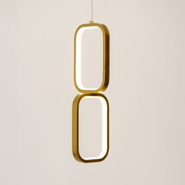 Gold and white metal dual frame hanging light glowing softly on white background for elegant contemporary wall decor.