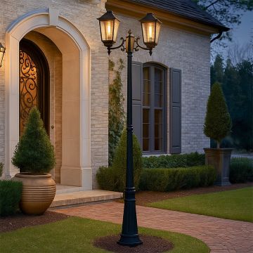 Elegant black metal dual head outdoor lamp post light on illuminating a classic home entrance creating warm pathway lighting for garden and porch Decor.