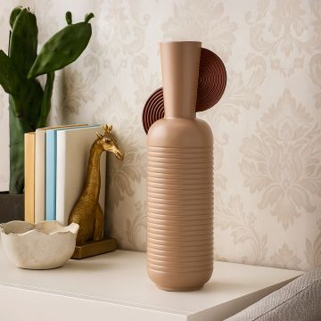 Modern ceramic decor vase in soft brown tones styled on a white console adding an elegant contemporary accent to living room or hallway interiors.