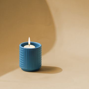 Blue ceramic textured candle holder shown on a clean white background ideal for modern home accents and cozy tabletop decor.