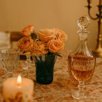 Blue gradient bubble glass vase styled on a wooden table adding an artistic accent to modern home décor.
