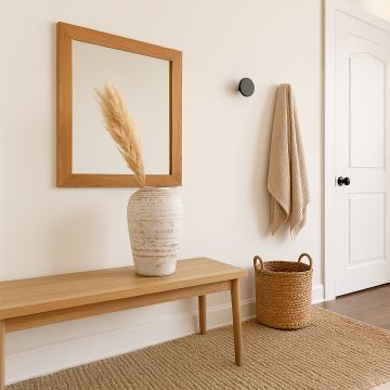 White rustic tall decorative vase styled in a warm modern room adding elegant artistic decor to living rooms hallways and contemporary interiors.