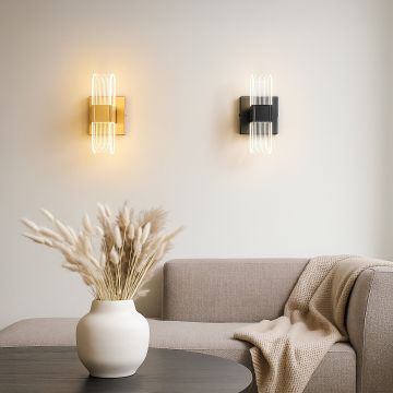 Gold metal wall light with ribbed clear glass shade adding warm modern lighting to a stylish home interior.