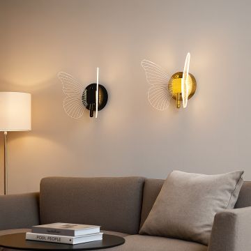 Gold butterfly wall light with clear acrylic wings adding soft decorative lighting to a modern kids bedroom interior.
