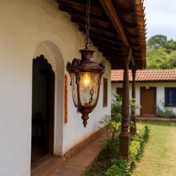 Antique hanging lantern light adding vintage charm and warm elegance to classic home decor setting.