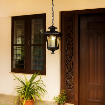 Black outdoor hanging lantern light adding a timeless vintage charm and soft illumination to elegant outdoor settings.