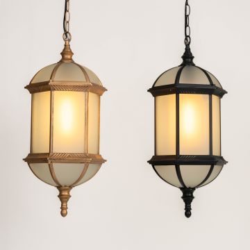 Warm outdoor scene with two classic hanging lanterns glowing softly against a light background creating an inviting entryway ambiance with elegant vintage detailing.
