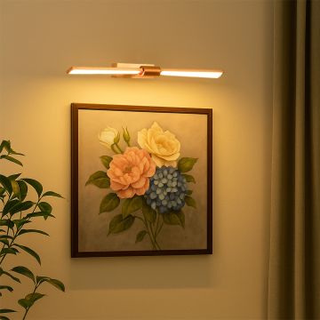 Gold metal picture light styled on a modern interior wall adding warm focused illumination for elegant home decor.