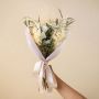 Elegant white infinity rose bouquet with preserved eucalyptus miscanthus and fern leaves creating luxury dried flowers.