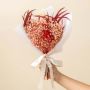Elegant preserved flower bouquet with red infinity rose pink babysbreath and white pampas grass tied with satin ribbon.