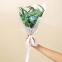 Elegant preserved bouquet with blue infinity rose green babysbreath pampas grass and eucalyptus tied with satin ribbon.