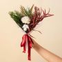 Elegant dried flower bouquet with cotton stem shola flower palm leaf and eucalyptus in red green white tones gift decor.