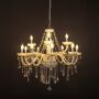 White chandelier with lights on glowing warmly with crystal accents and glass arms against a black background.