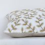 White cotton cushion cover decorated with light olive botanical branches perfect for minimalist home décor with a calm natural look and a soft breathable skin friendly fabric.
