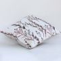 White cotton cushion cover with maroon and grey botanical design providing a refined natural accent for modern home décor with a durable soft and skin friendly fabric feel.