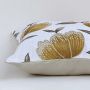 White cotton cushion cover showcasing a large golden botanical design perfect for premium home décor with a soft comfortable and skin friendly fabric texture.