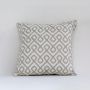 Beige geometric embroidered cushion displayed on a clean white background for a minimal modern look.