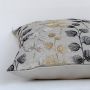 Closeup of cotton cushion embroidery showing intricate gold grey and black leaf stitching and soft textured fabric ideal for stylish home decor accents.